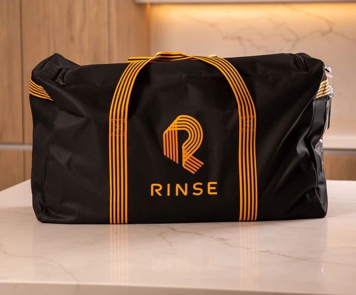 A Rinse Wash and Fold bag on a counter